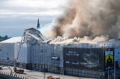 Smoke billows following a fire at the Old Stock Exchange, Boersen, in Copenhagen