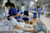 A medical staff member takes care of a patient in the intensive care unit of Incheon Medical Center