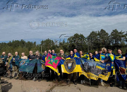 Ukrainian POWs are seen after a swap at an unknown location in Ukraine