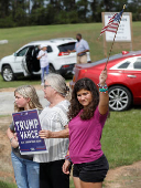 Republican presidential nominee Donald Trump and Georgia Governor Brian Kemp speak to the press about the impact of Hurricane Helene, in Evans