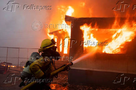 Palisades Fire burns during a windstorm on the west side of Los Angeles