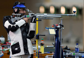 FILE PHOTO: India's Bindra, winner of the men's 10m air rifle shooting event, takes a shot at the Barry Buddon shooting centre at the 2014 Commonwealth Games in Glasgow