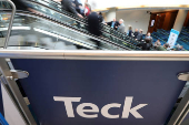 FILE PHOTO: Visitors pass a sign of sponsor Teck Resources at a conference in Toronto, Ontario, Canada