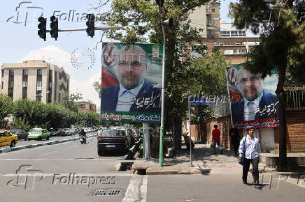 A banner of presidential candidate Mohammad Bagher Ghalibaf ?is displayed on a street in Tehran