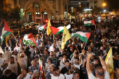 People protest following an Israeli strike on Lebanon, in Tehran