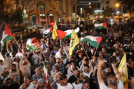 People protest following an Israeli strike on Lebanon, in Tehran