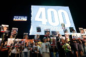 People rally demanding the release of hostages kidnapped during the deadly October 7, 2023 attack, in Tel Aviv