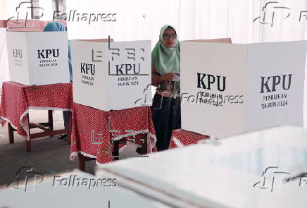 Voters cast their ballows in regional government elections in Indonesia