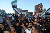 Celebrations in Tripoli after Syrian rebels capture Damascus and overthrow al-Assad