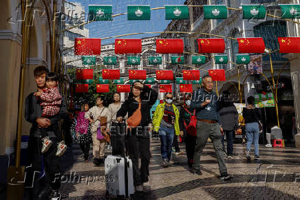 Macau and Chinese flags hang at Senado Square, in Macau