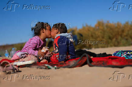 Migrants seeking asylum in the United States gather on the banks of the Rio Bravo river in Ciudad Juarez