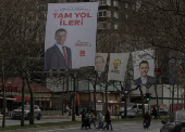 Election banners of Istanbul's mayor Ekrem Imamoglu, President Tayyip Erdogan and Murat Kurum hang along a street ahead of the local elections in Istanbul