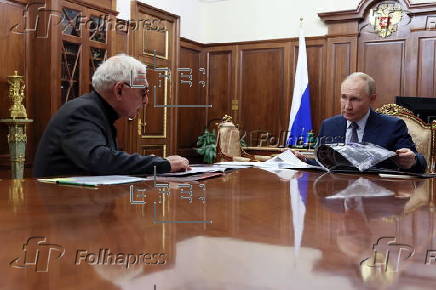 Russian President Vladimir Putin meets with Director general of Mosfilm Shakhnazaro in Moscow