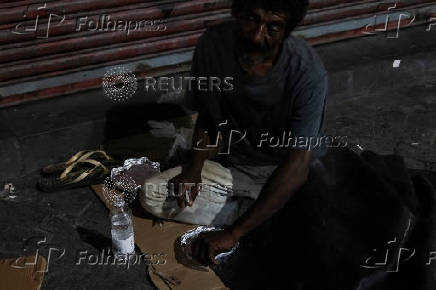 Anjos da Noite (Night Angels) NGO distributes food to homeless people on Christmas Eve in Sao Paulo