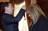 FILE PHOTO: Russian President Dmitry Medvedev awards Service to the Fatherland order to singer Pugacheva on her in Moscow