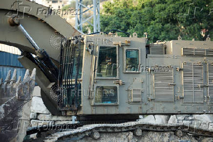 An army excavator is pictured in Tulkarm