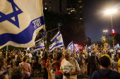 People attend a protest against the government and to show support for the hostages who were kidnapped during the deadly October 7 attack, in Tel Aviv