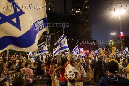 People attend a protest against the government and to show support for the hostages who were kidnapped during the deadly October 7 attack, in Tel Aviv