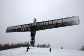 Snowfall at Antony Gormley's Angel of the North, in Gateshead