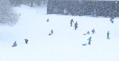 People are sledging in Aviemore, Scotland,