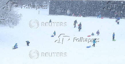 People are sledging in Aviemore, Scotland,