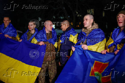 Ukrainian prisoners of war (POWs) return after a swap, in an undisclosed location