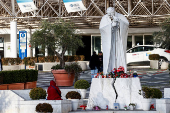 Members of the media gather outside the Gemelli Hospital where Pope Francis is admitted to continue treatment for ongoing bronchitis, in Rome