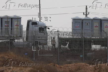 Humanitarian trucks carrying provisions waiting in line on the Egyptian side of the border near Kerem Shalom crossing