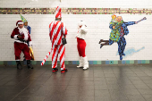 Revellers take part in SantaCon in New York City