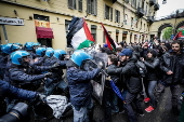University students take part in a pro-Palestinian march in Turin