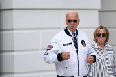 U.S. President Joe Biden wears the team USA Olympics jacket as he departs from the South Lawn of the White House
