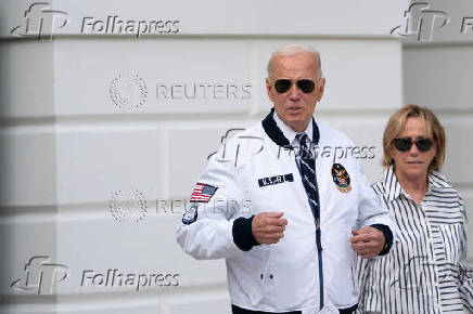 U.S. President Joe Biden wears the team USA Olympics jacket as he departs from the South Lawn of the White House