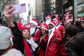 Revellers take part in SantaCon in New York City