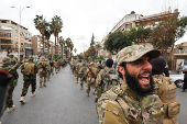 Khaled Brigade, a part of Hay'at Tahrir al-Sham (HTS), hold a military parade, in Damascus