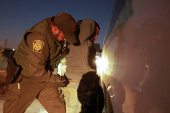 Migrants are detained by U.S. Border Patrol agents in New Mexico