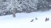 People are sledging in Aviemore, Scotland,