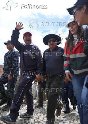 Bolivian President Luis Arce Catacora inspects the Inca Llojeta area, where intense rains and illegal earth movements caused landslides that flooded several homes, in La Paz