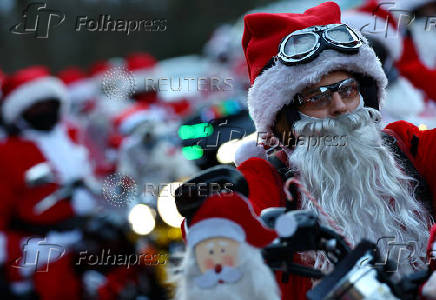 Riding Santas take part in their 25th Harley Davidson motorcycle ride near Neustadt an der Weinstrasse