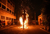 Devil-shaped pinatas are burned and sold before and during the annual 'Quema del Diablo' celebration in Guatemala City