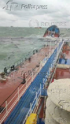 A view from the Volgoneft 239 oil tanker shows the sinking part of the vessel, whose damage caused an oil spill, in the Kerch Strait