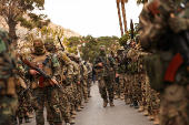 Khaled Brigade, a part of Hay'at Tahrir al-Sham (HTS), hold a military parade, in Damascus