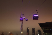 A view of the cable cars at the Royal Docks during foggy weather in London