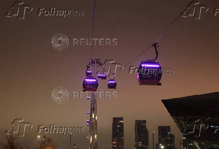 A view of the cable cars at the Royal Docks during foggy weather in London