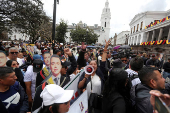 Supporters of Ecuador's President Daniel Noboa react as they listen to his speach in front of the Government Palace in Quito