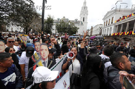 Supporters of Ecuador's President Daniel Noboa react as they listen to his speach in front of the Government Palace in Quito