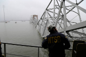 NTSB investigators work on the cargo vessel Dali, which struck and collapsed the Francis Scott Key Bridge, in Baltimore