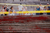 Activists pour red paint on the Spanish Steps to protest against femicides in Rome
