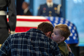 Mourners view the casket of former President Jimmy Carter as he lies in repose at the Jimmy Carter Presidential Library and Museum in Atlanta