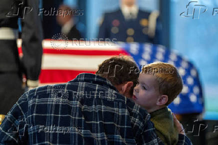 Mourners view the casket of former President Jimmy Carter as he lies in repose at the Jimmy Carter Presidential Library and Museum in Atlanta