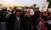 Supporters of Hezbollah Brigades protest against the killing of Nasrallah, in central Baghdad